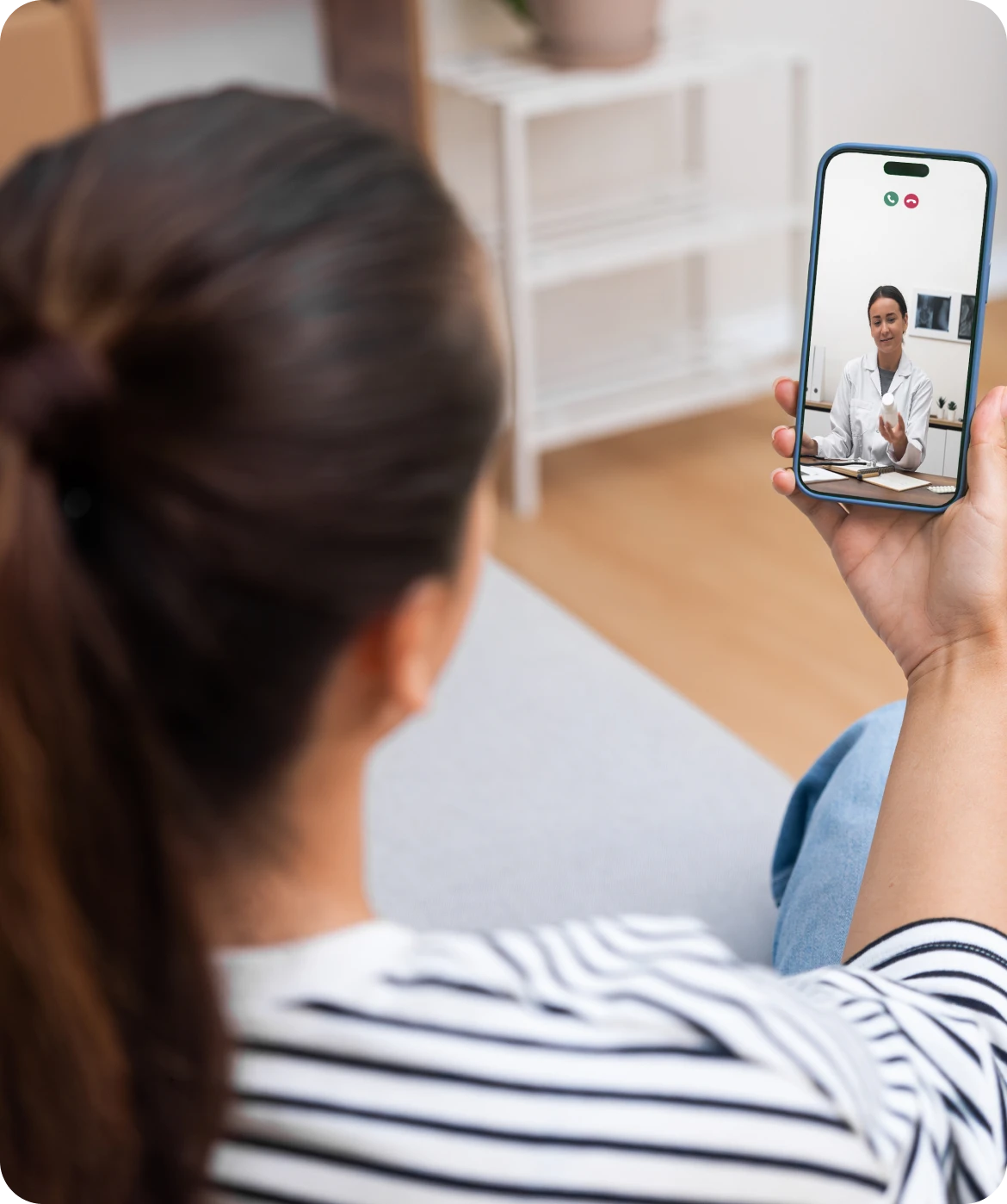 Person video calling a doctor on smartphone
